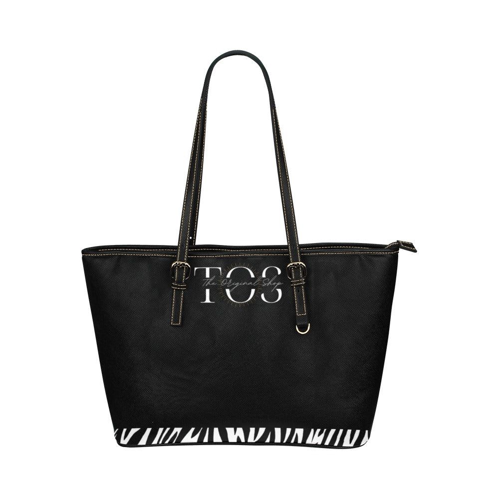 Bolso T.O.S. Cebra Lovers | Shopper Zebra LoversShopper animal print Zebra Exclusivo Bolso, de gran capacidad y diseño exclusivo en T.O.S. Bolso Shopper de cuero PU (Grande) Material: cuero PU de alta calidad impresión a dos caras. Medidas: 36cm largo , 2