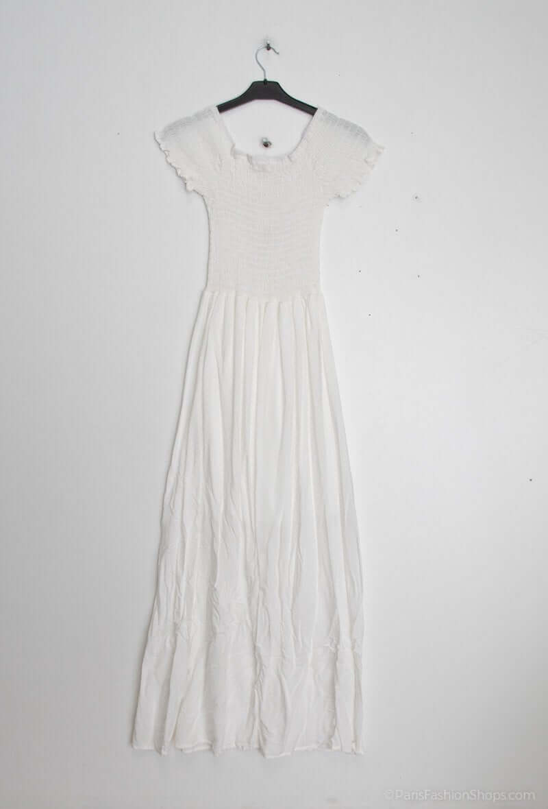 Vestido Fruncido Liso PortugalUn vestido muy versatil para una mujer sofisticada. Este vestido largo con escote bardot y corte fruncido en la parte superior del top, junto a una falda larga y holgada, te hará lucir elegante y exclusiva. Hecho con 95% algo