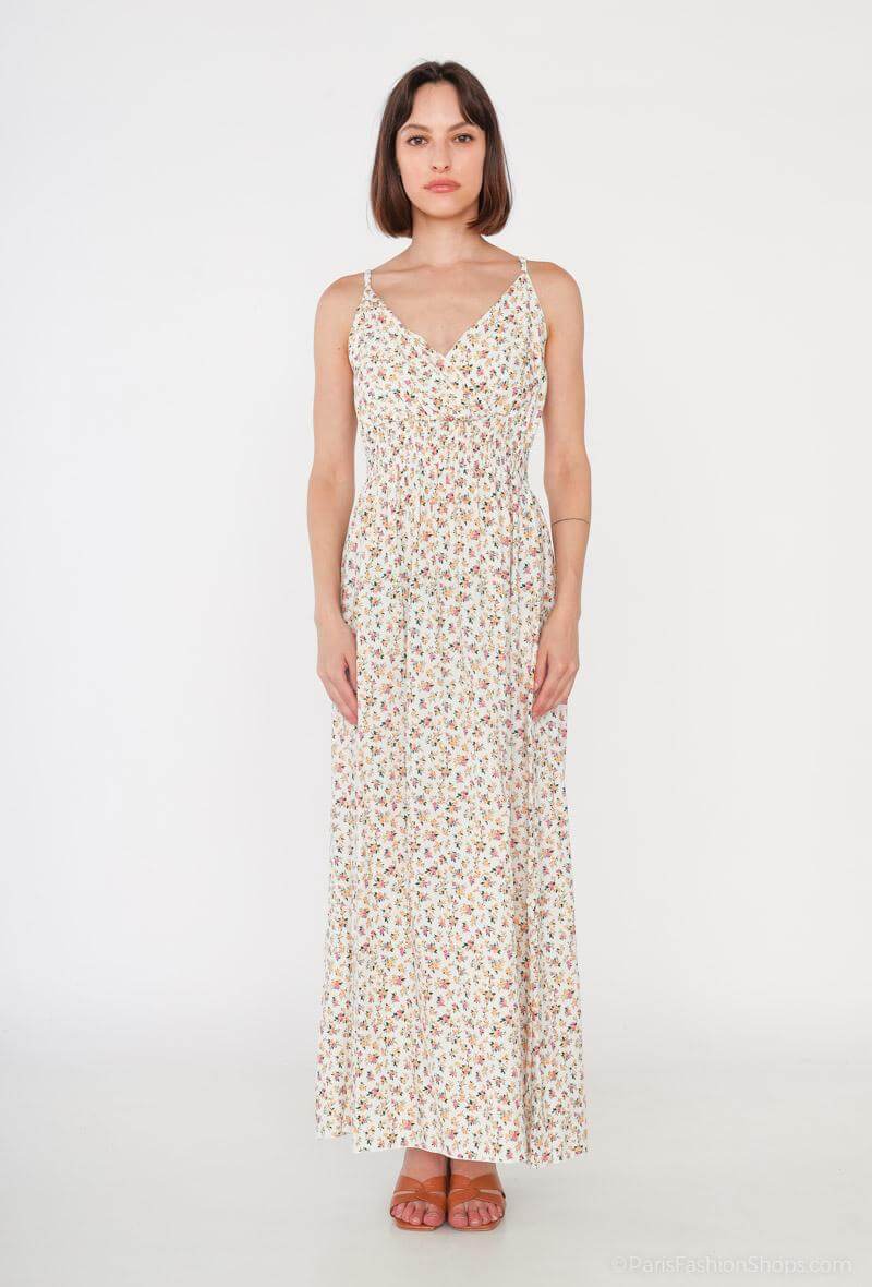 Vestido Glorie CremaVestido Largo Cruzado Glorie El Vestido Glorie Amarillo es una prenda elegante y versátil con un escote cruzado y un estampado de pequeñas flores que lo hacen único. Sus tirantes regulables ofrecen un ajuste perfecto y cómodo. Ideal pa