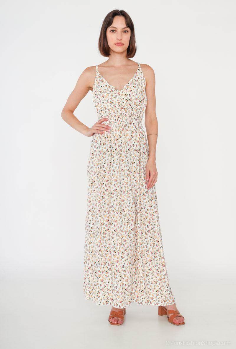 Vestido Glorie CremaVestido Largo Cruzado Glorie El Vestido Glorie Amarillo es una prenda elegante y versátil con un escote cruzado y un estampado de pequeñas flores que lo hacen único. Sus tirantes regulables ofrecen un ajuste perfecto y cómodo. Ideal pa