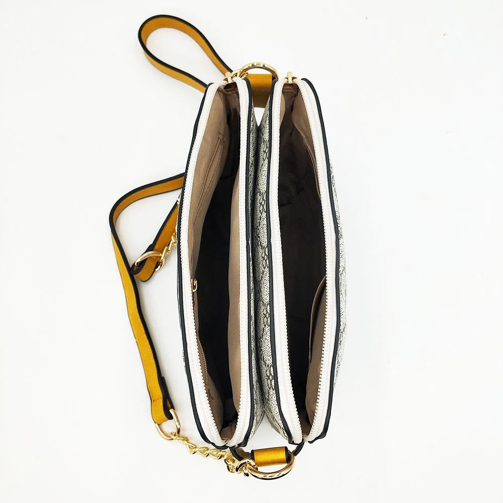 Bolso Doble MonogramaBolso Diseño Doble Monograma Elegante y versatil a su vez. Este bolso de tamaño medio es perfecto para llevar todo lo necesario cada dia. Con su doble compartimento ofrece el doble de seguridad pudiendo guardar el teléfono y monedero