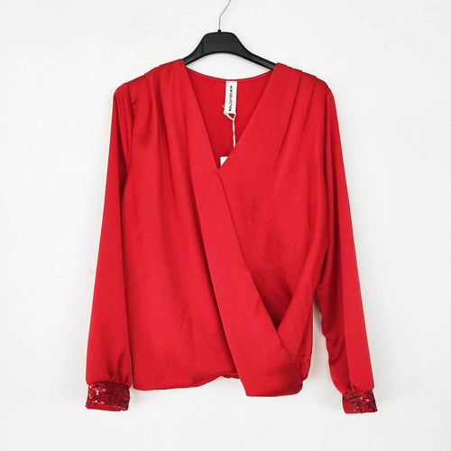 Blusa Cruzada Lentejuelas | Pailletten Damen BluseBlusa cruzada con lentejuelas Camisa clásica con escote cruzado y detalle de lentejuelas en los puños. Goma en la cinturilla, en la parte trasera, para un ajuste y comodidad únicos! Talla unica S/L (36/40)