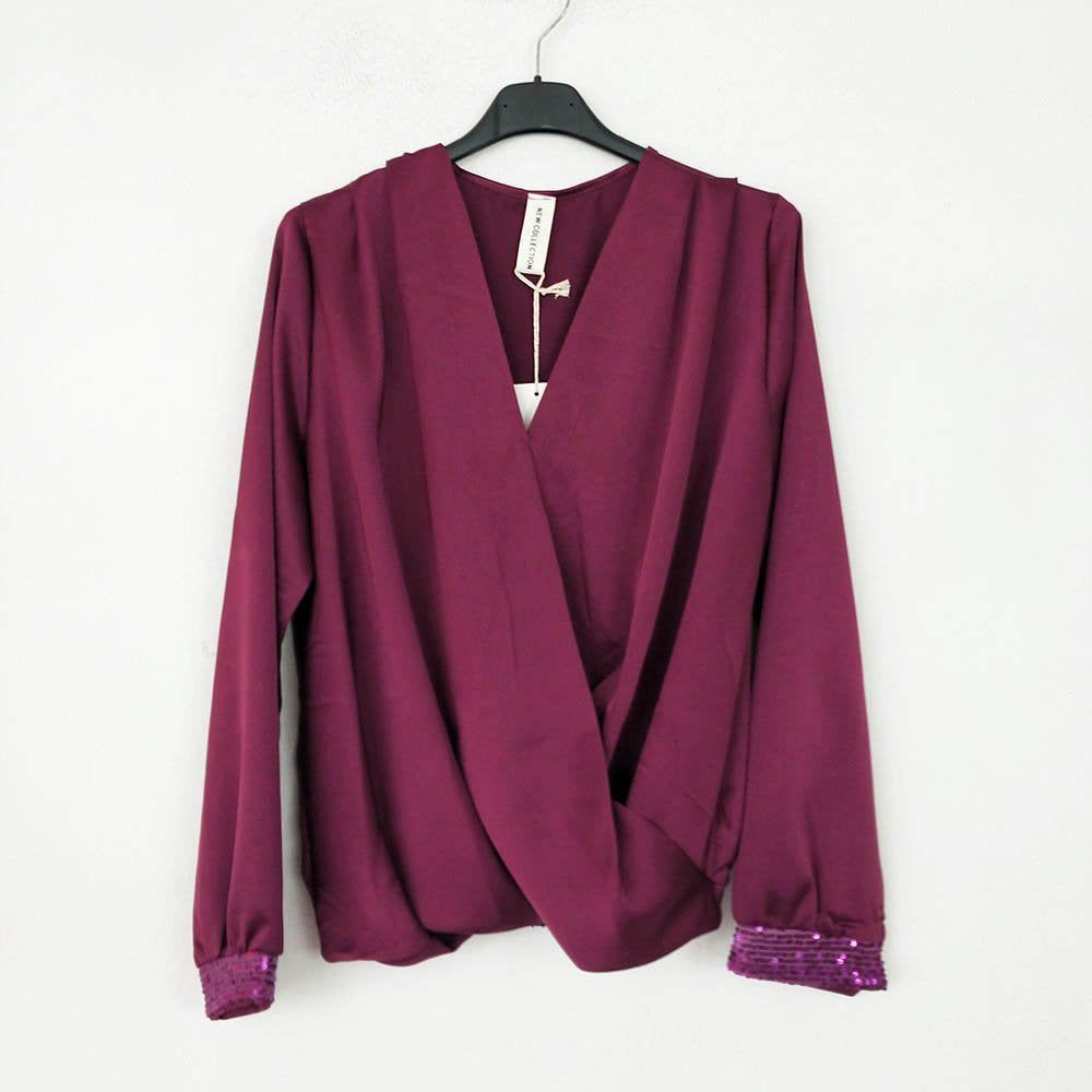 Blusa Cruzada Lentejuelas | Pailletten Damen BluseBlusa cruzada con lentejuelas Camisa clásica con escote cruzado y detalle de lentejuelas en los puños. Goma en la cinturilla, en la parte trasera, para un ajuste y comodidad únicos! Talla unica S/L (36/40)